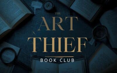 A table of open books in a dark background behind the words "The Art Thief" book club.