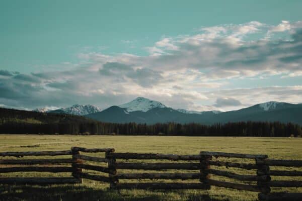 Photo of ranch in mountains, meant to evoke Yesteryear book club questions.