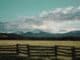Photo of ranch in mountains, meant to evoke Yesteryear book club questions.